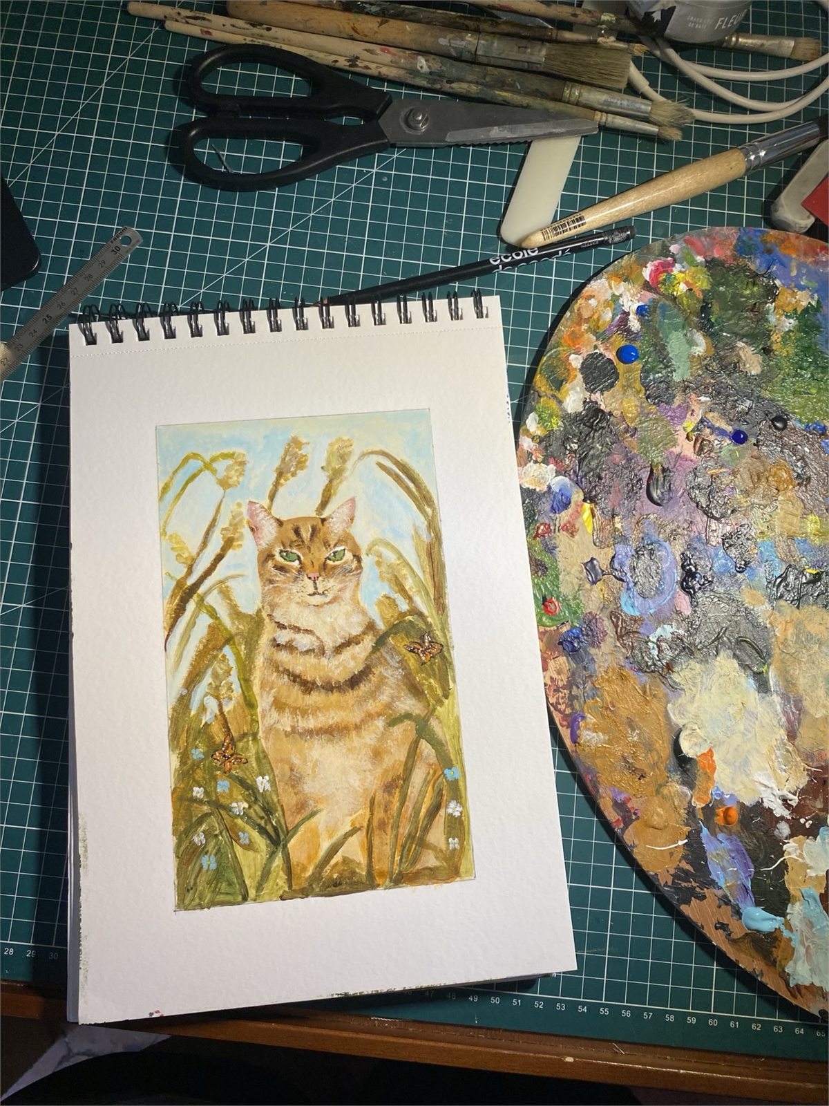 Sarah's painting of a ginger cat sitting among tall grasses